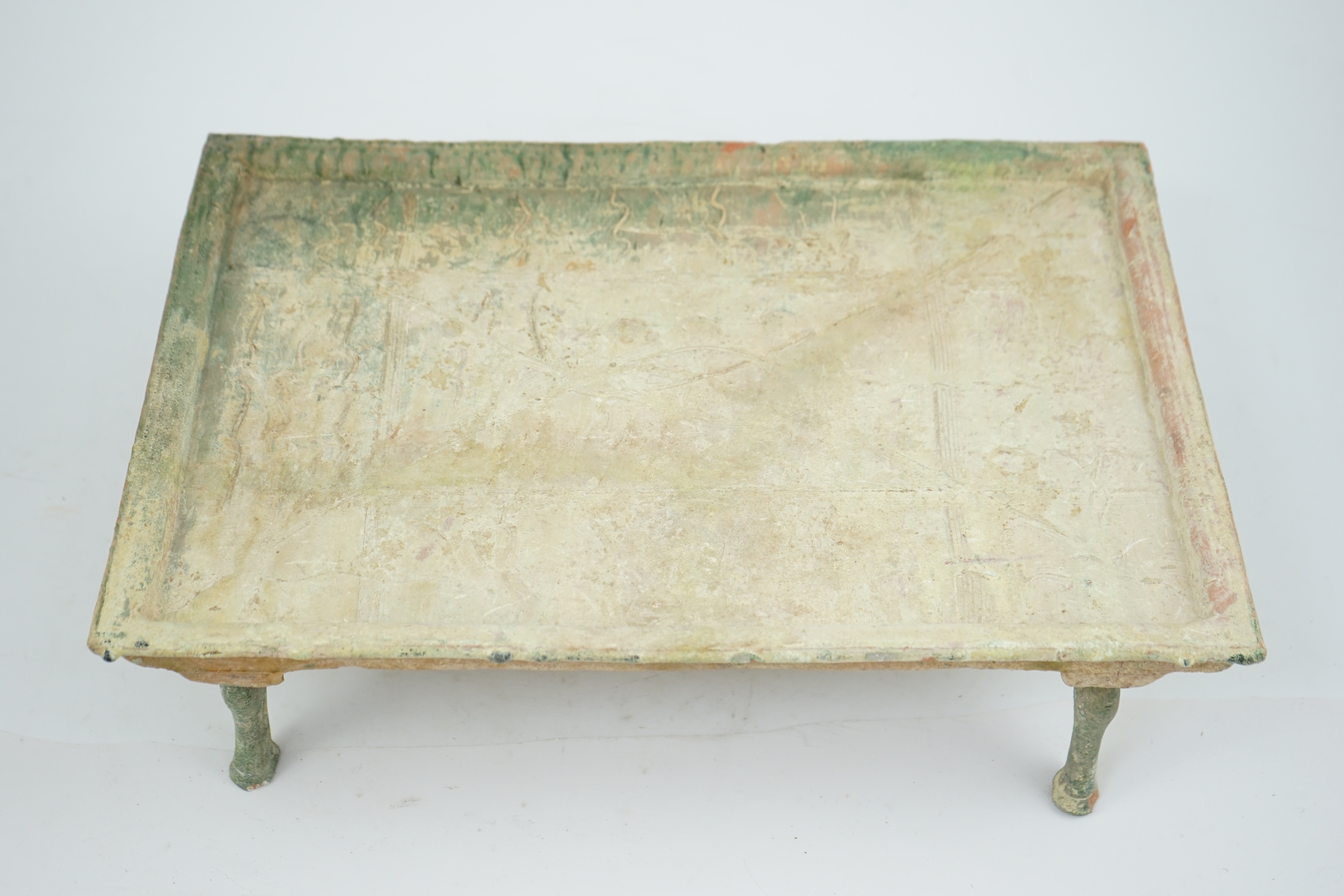 A rare Chinese glazed decorated pottery table with legs, Han Dynasty (206 BC-AD 220).